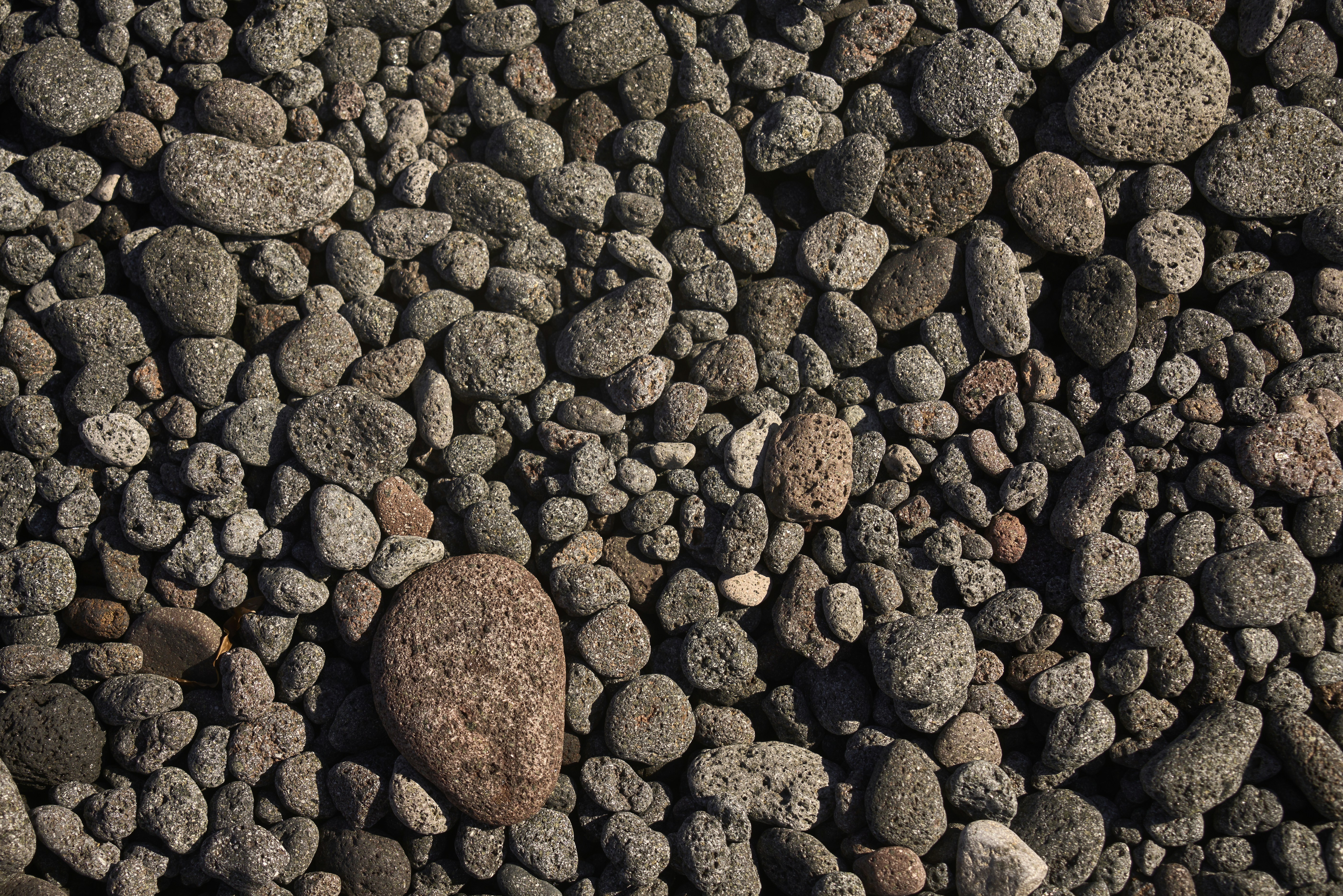 A close-up of many small, rounded stones.