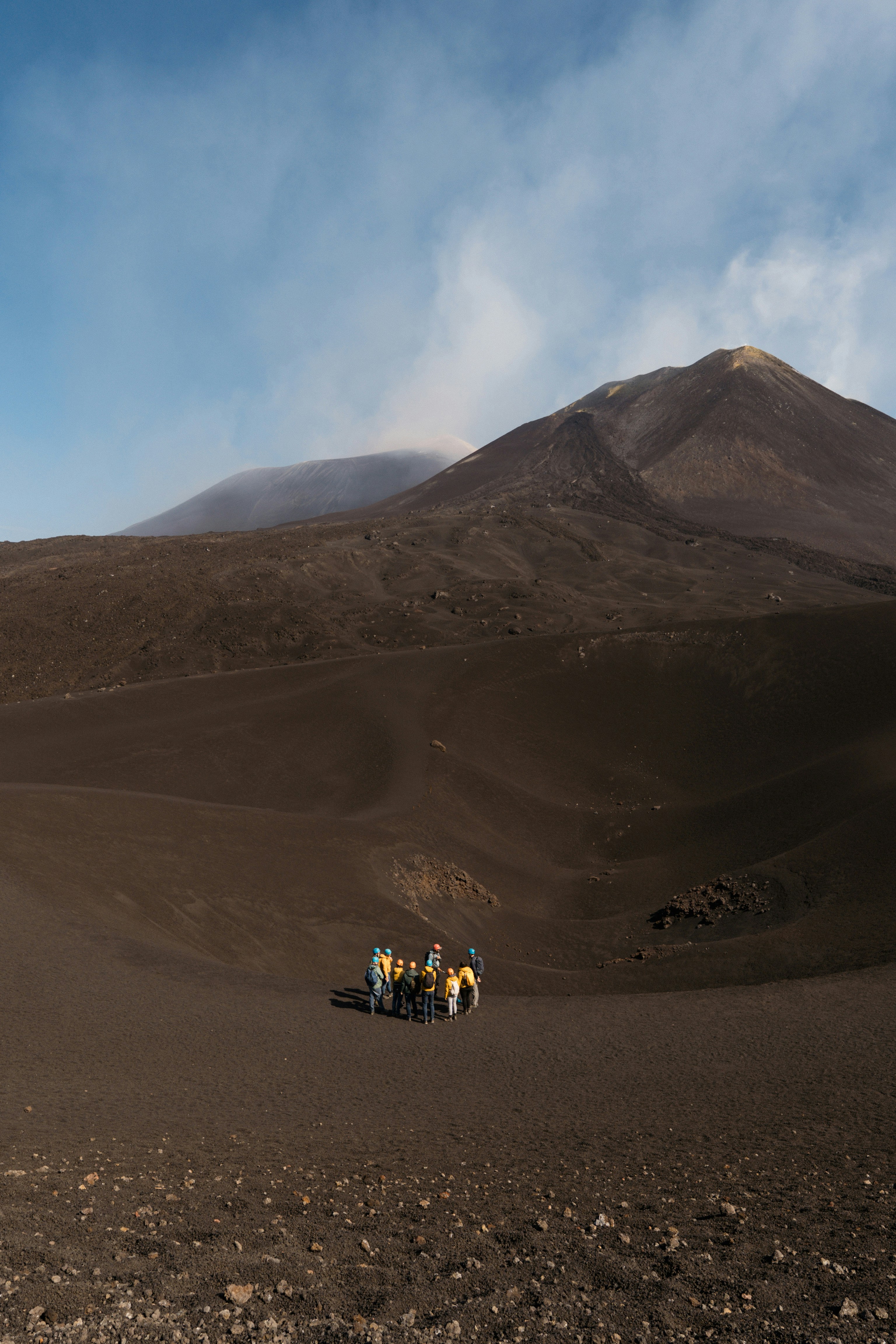 Group of hikers on a volcanic landscape