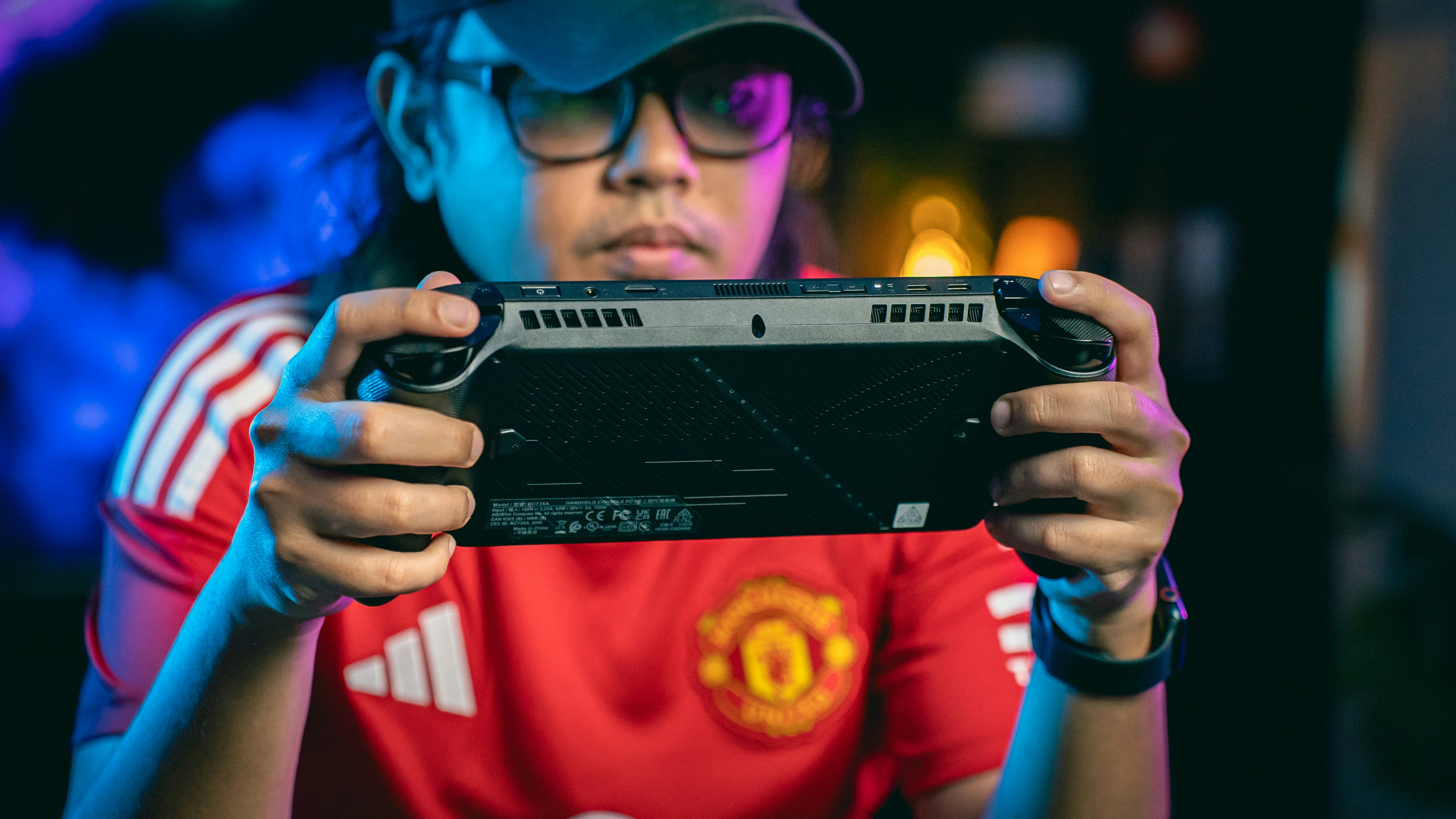 Person playing a handheld gaming console