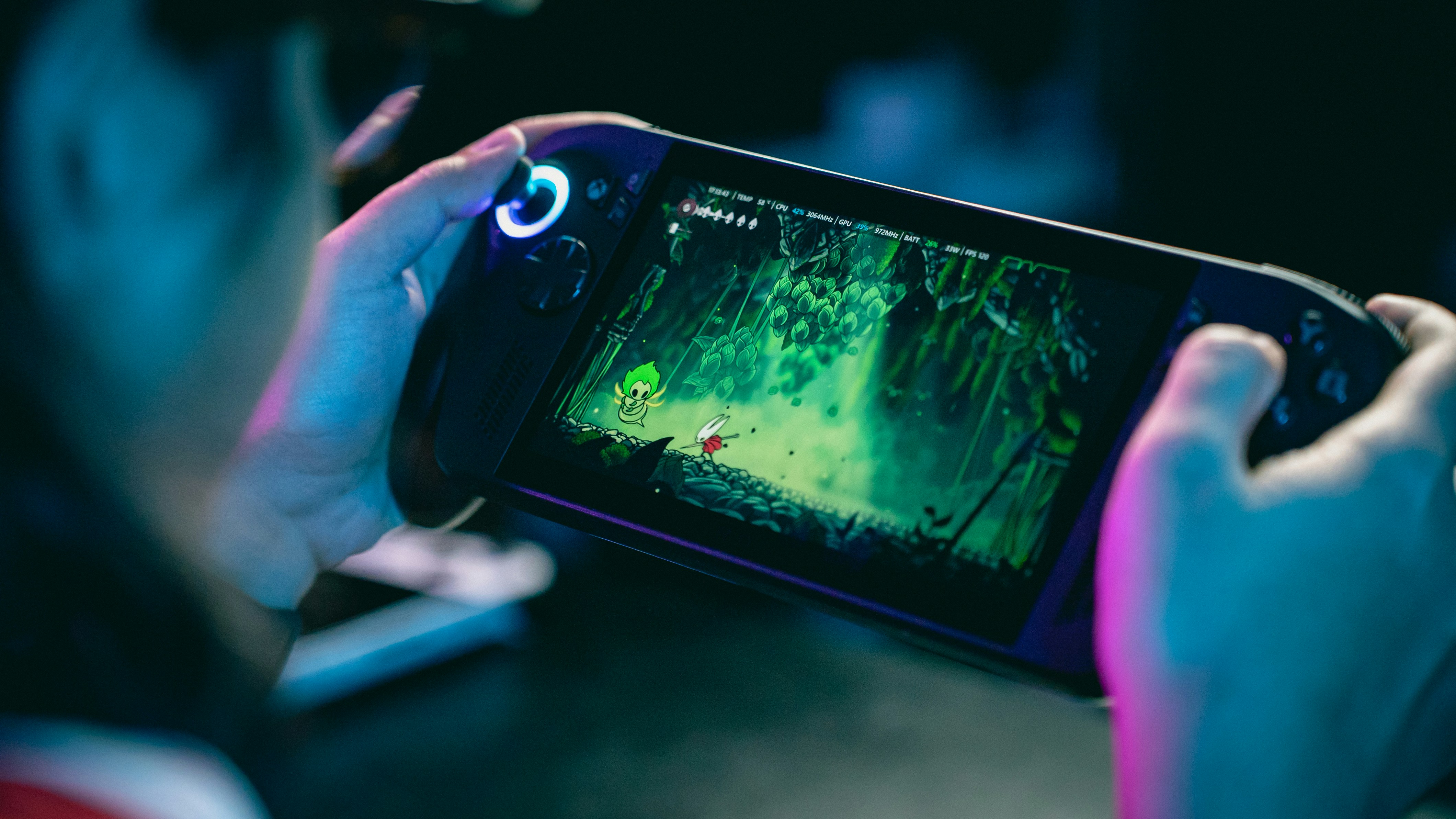 Person playing a video game on a portable console.