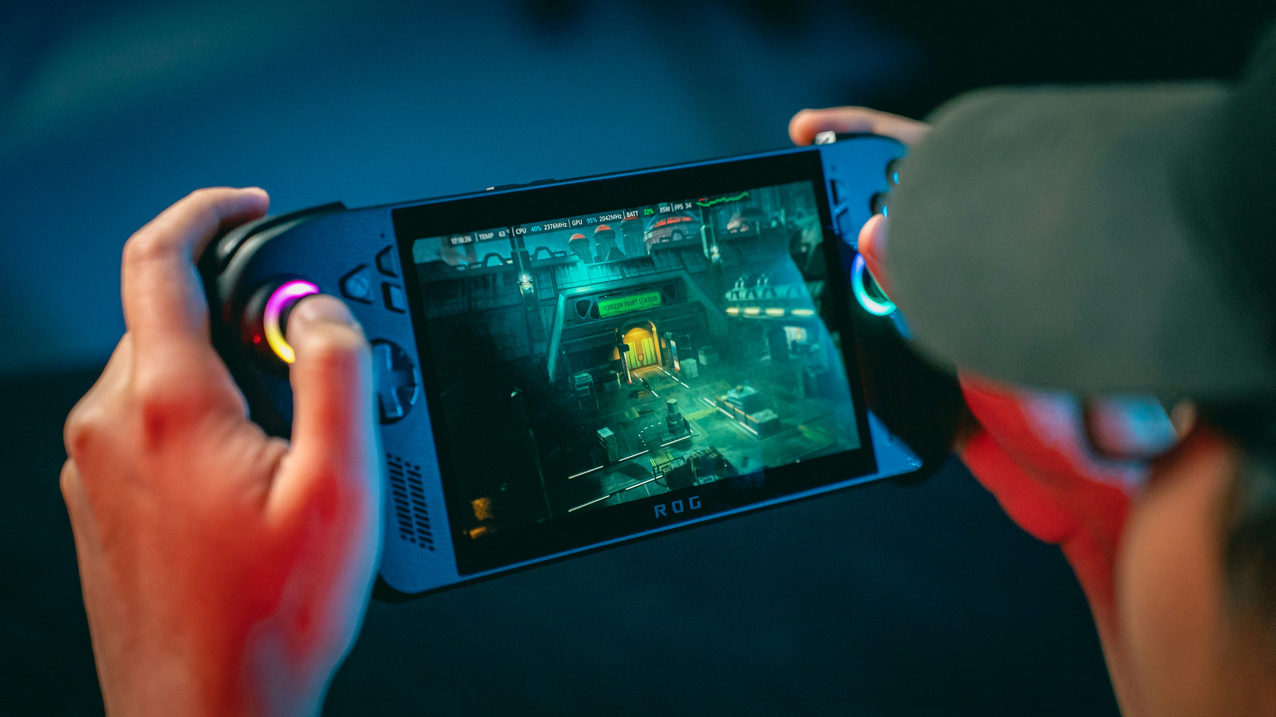 Person playing a video game on a handheld device.