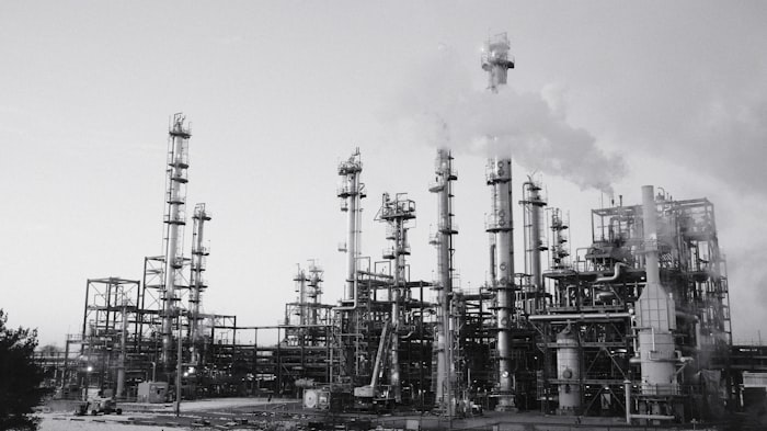 Oil refinery with stacks and industrial equipment