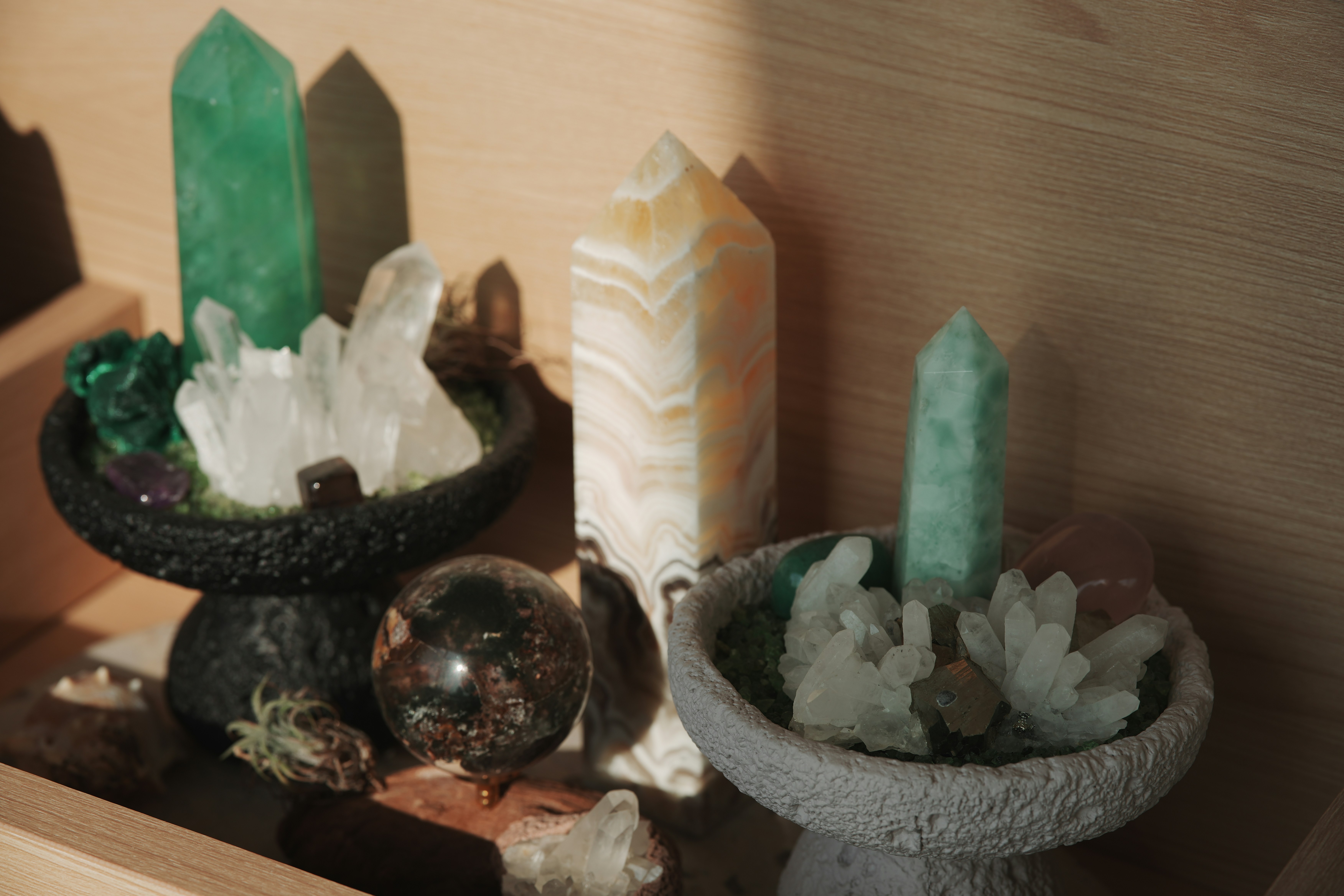 Various crystals and stones arranged on shelves.