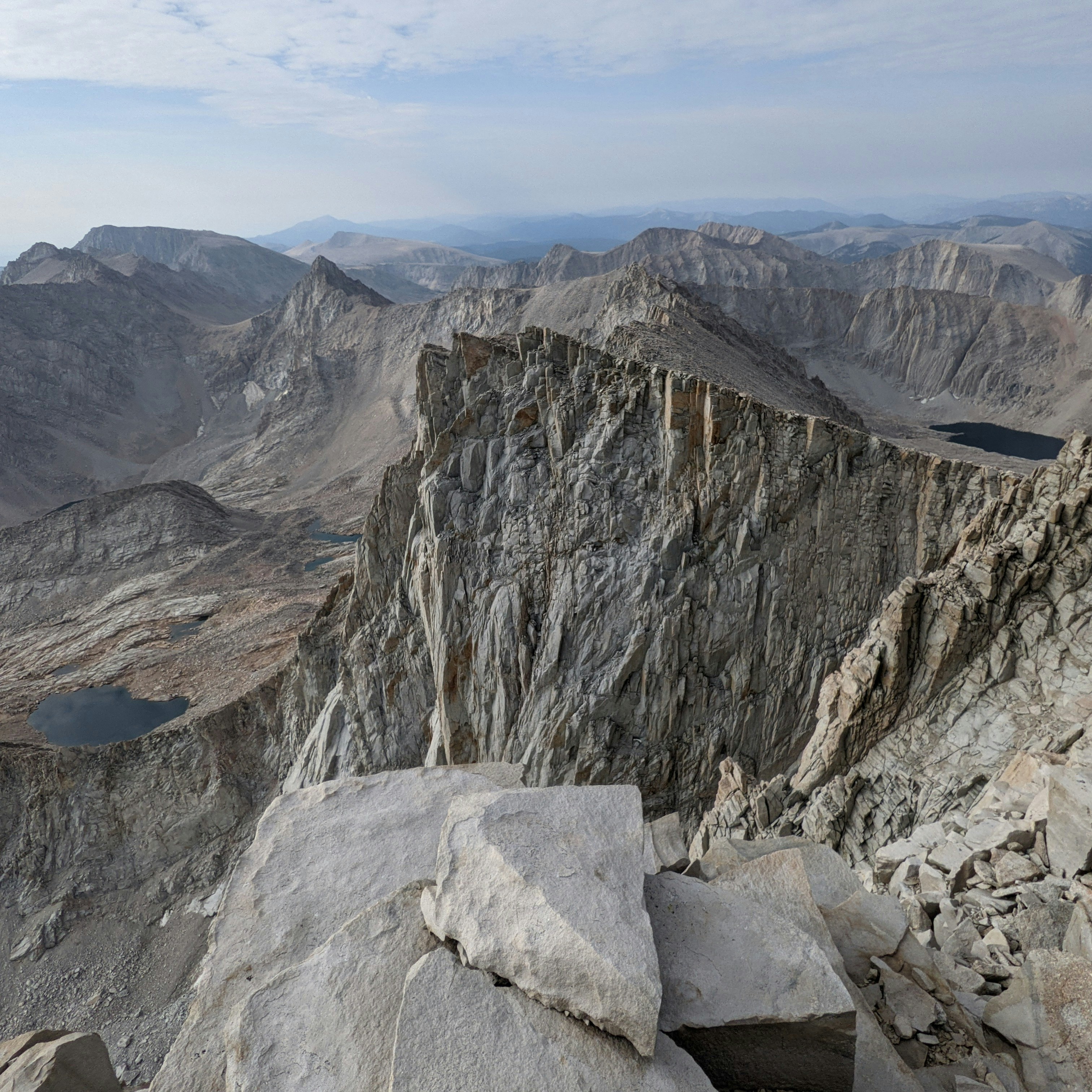 Rugged mountain peaks with small lakes below.