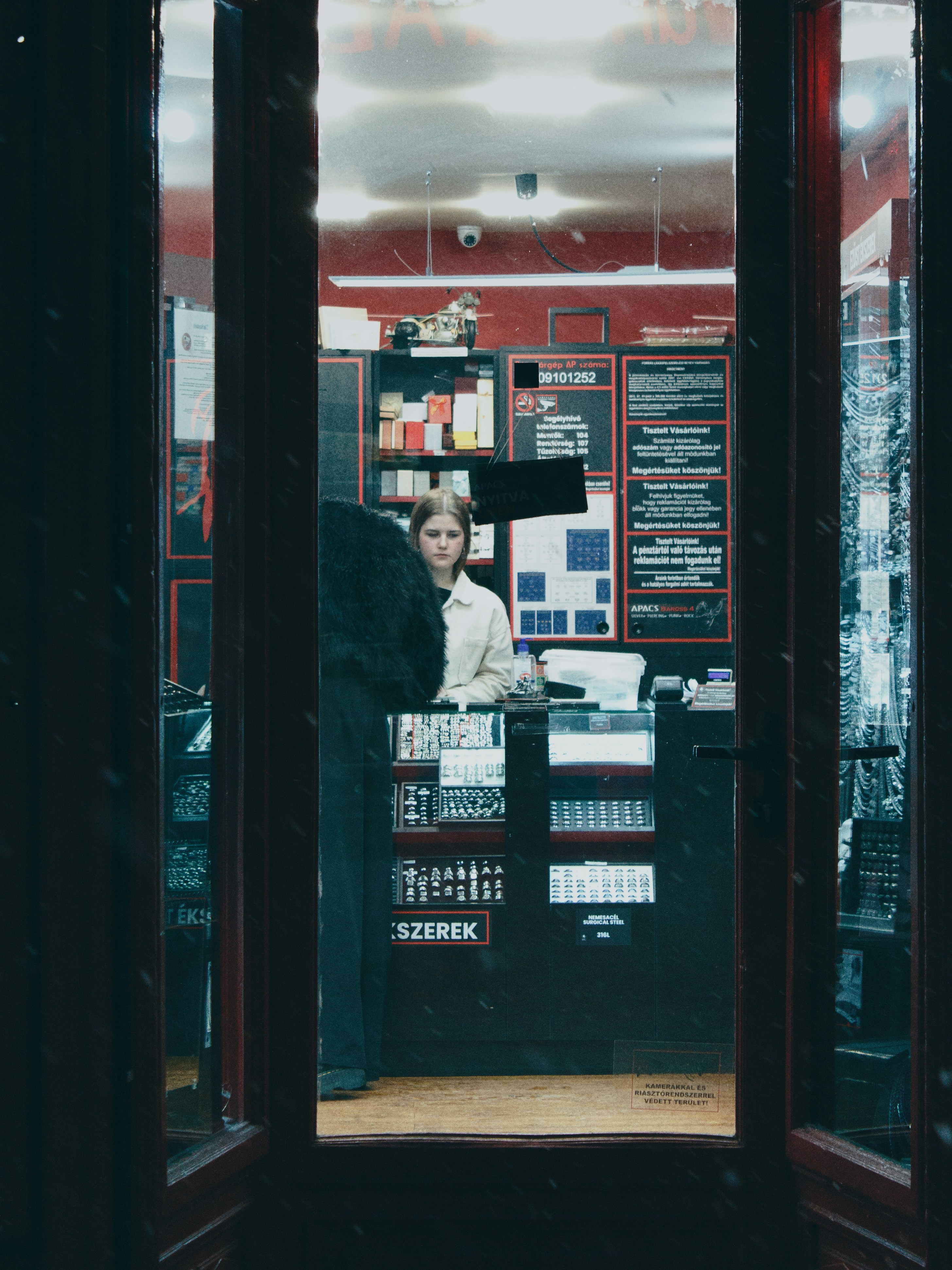 Woman working at a counter in a store