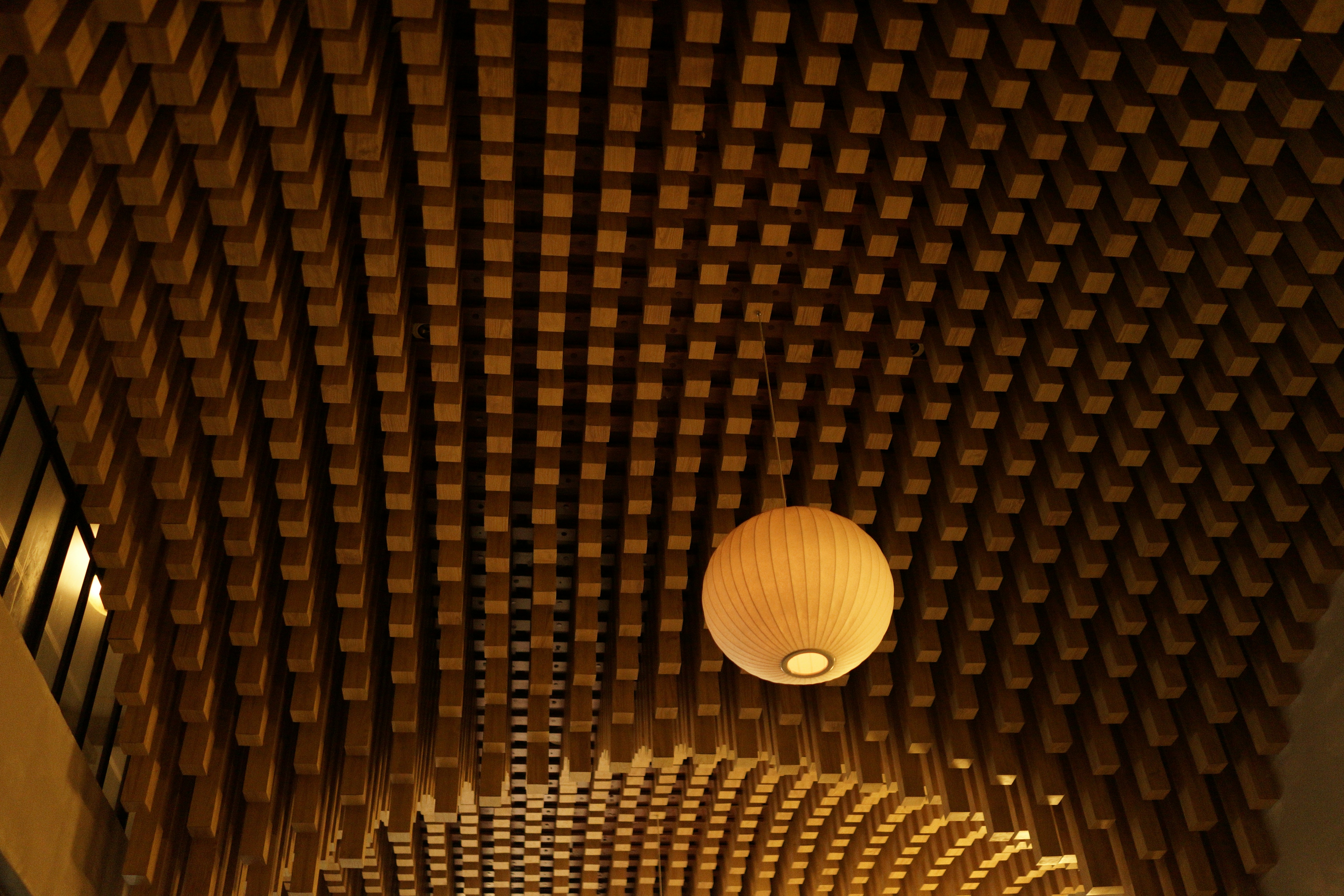 Wooden ceiling with a spherical light fixture