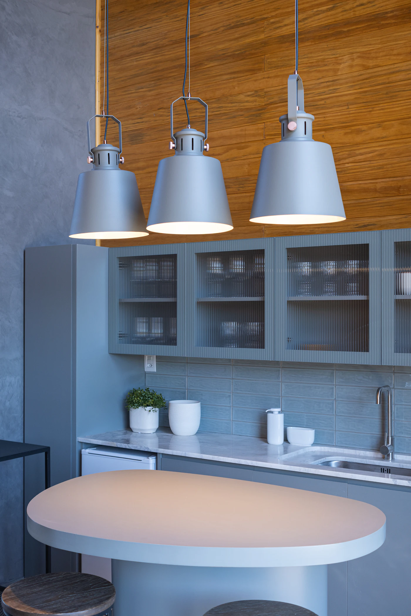 Woven pendant lights glowing warmly in a study of interior atmosphere.