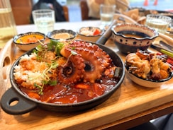 A whole octopus served with rice and sauce