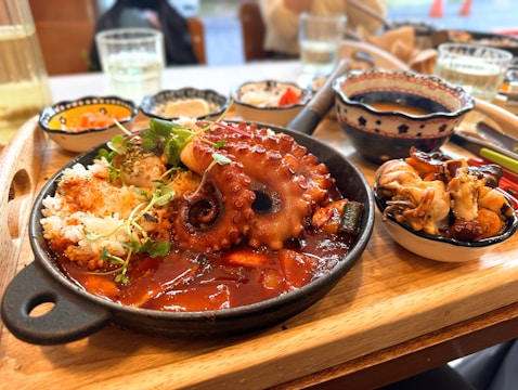 A whole octopus served with rice and sauce