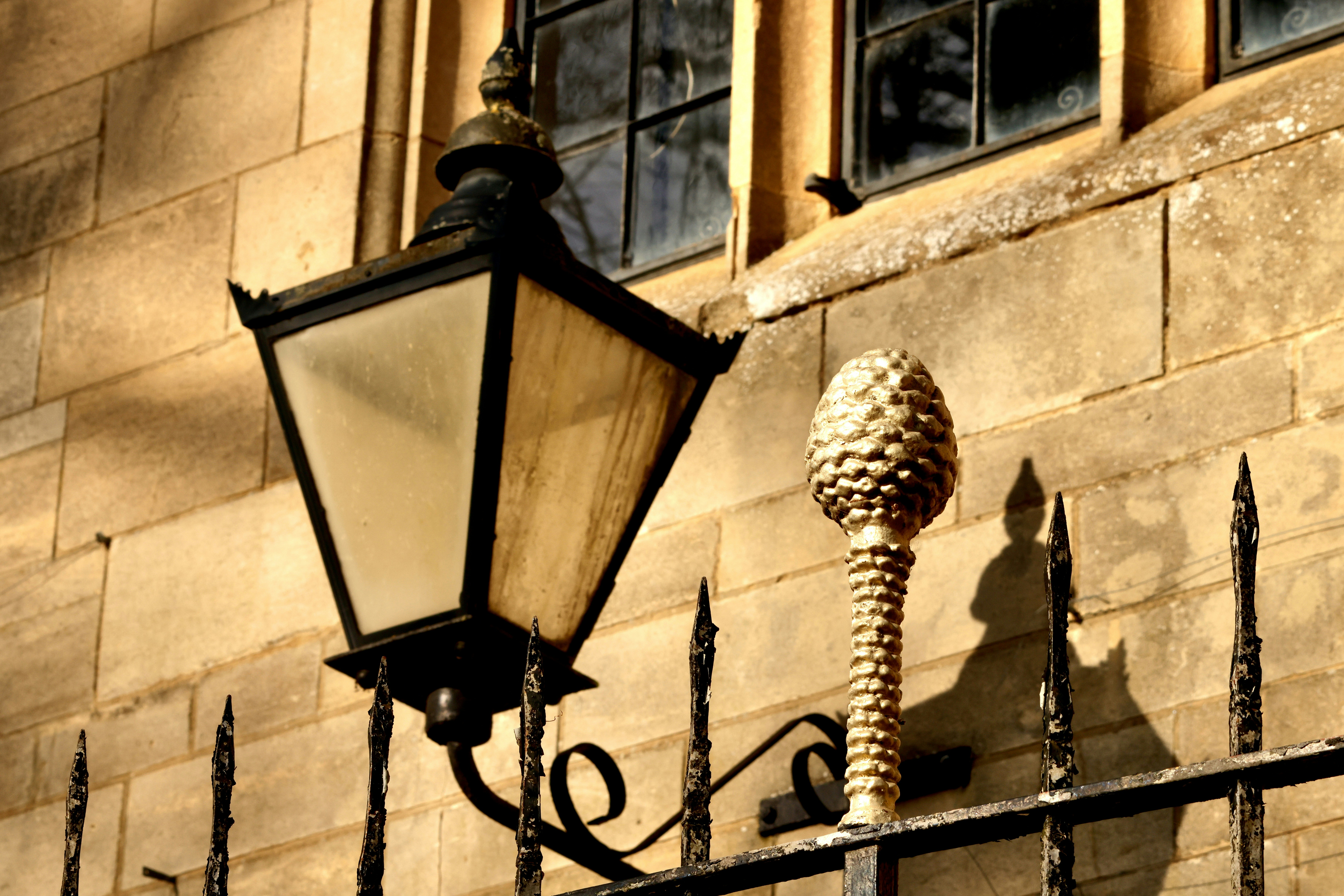 Old-fashioned lantern attached to a stone wall