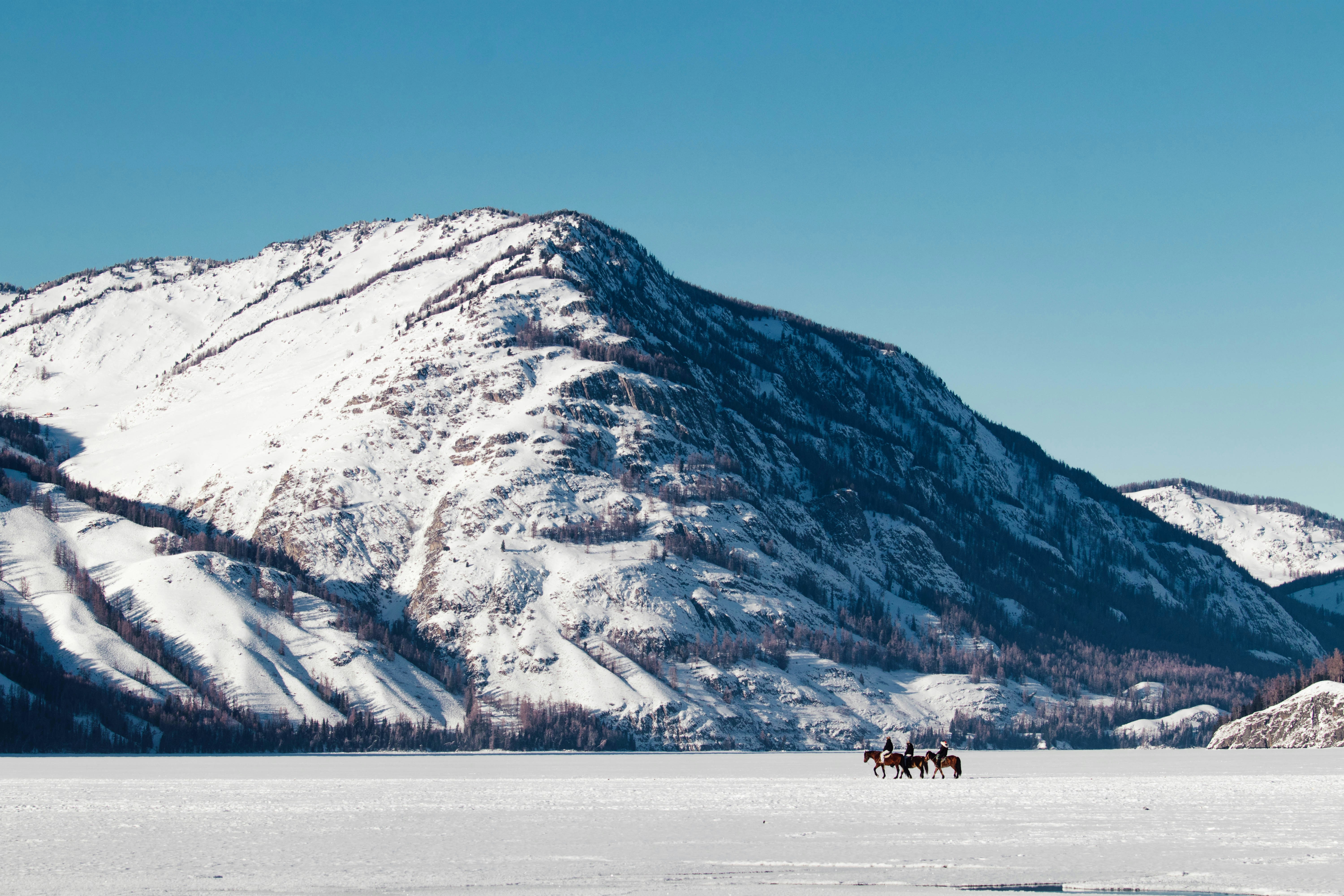 Snowy mountain range under a clear blue sky