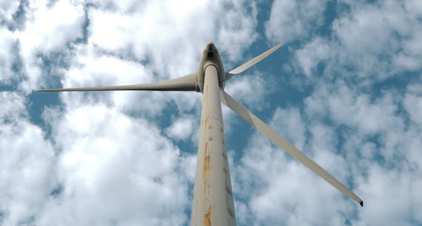 Wind turbine against a bright blue sky