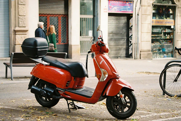 Red scooter on an urban street