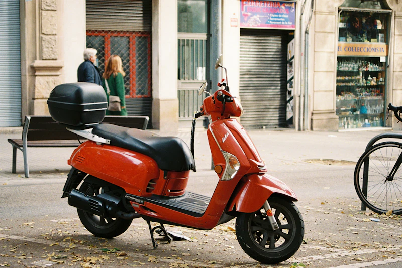 Red scooter on an urban street
