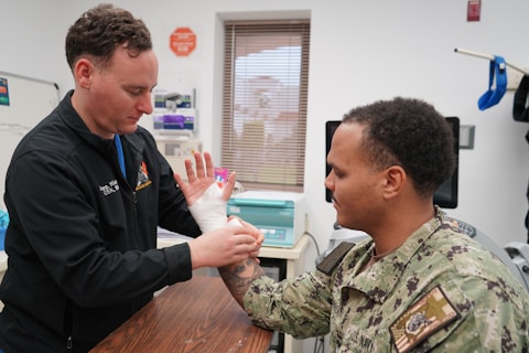 Medical professional treating an injured patient