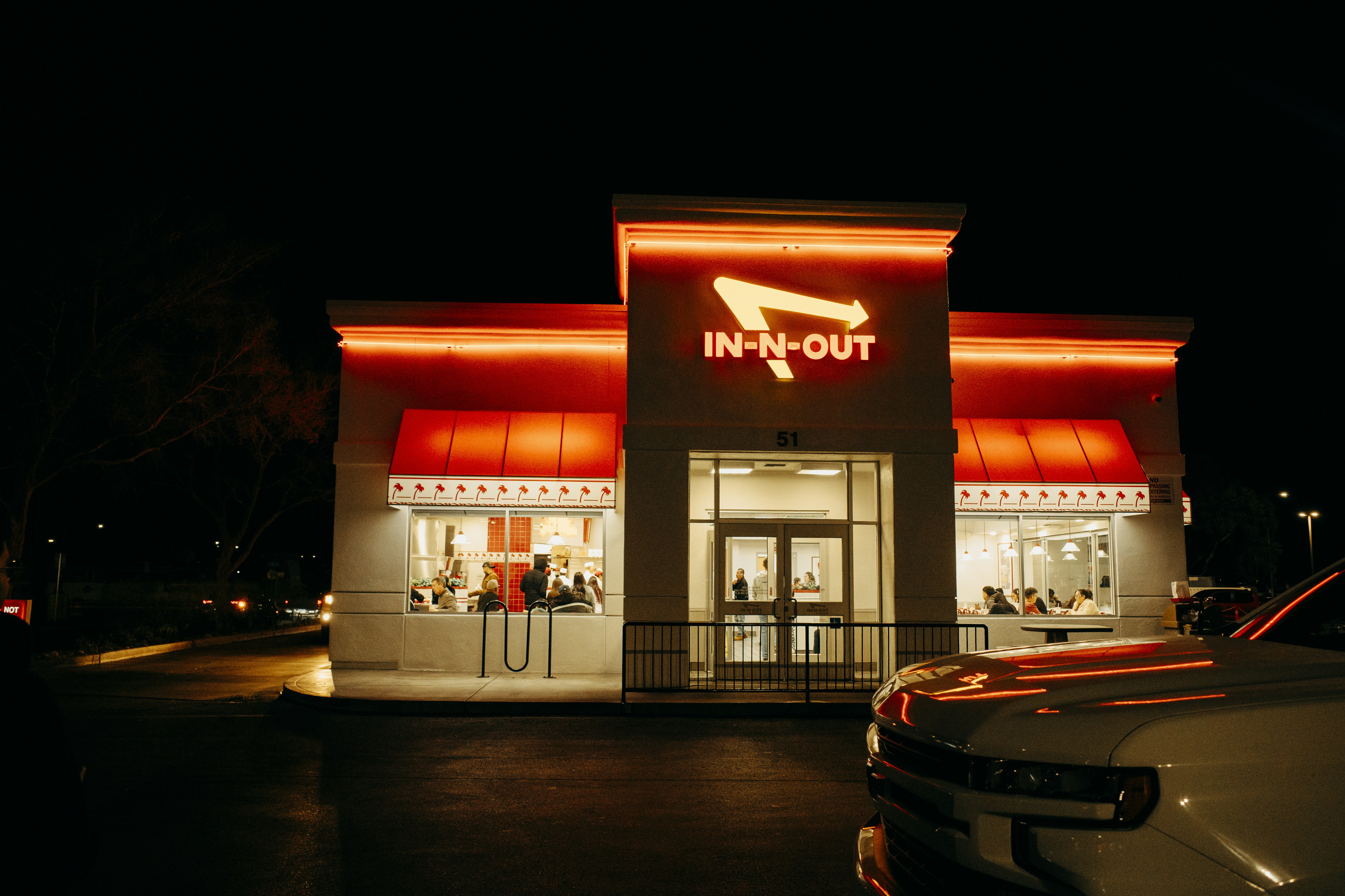 An in-n-out burger restaurant at night.
