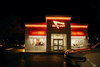 An in-n-out burger restaurant at night.