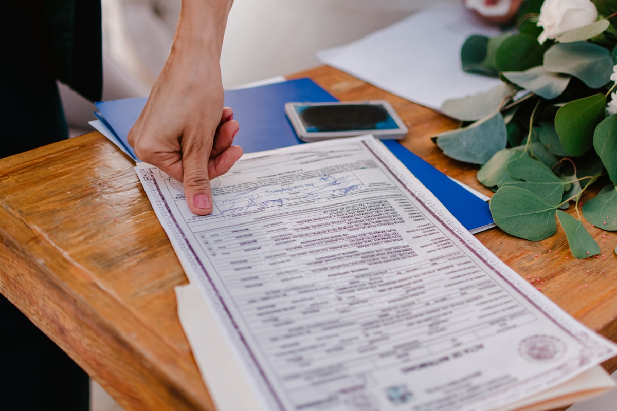 Printed documents spread across a wooden surface — representing discovery document review