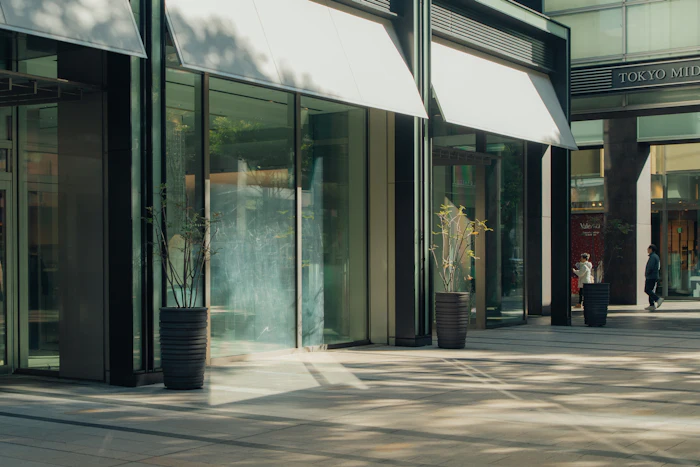 Modern glazed sliding entrance doors installed at a commercial building