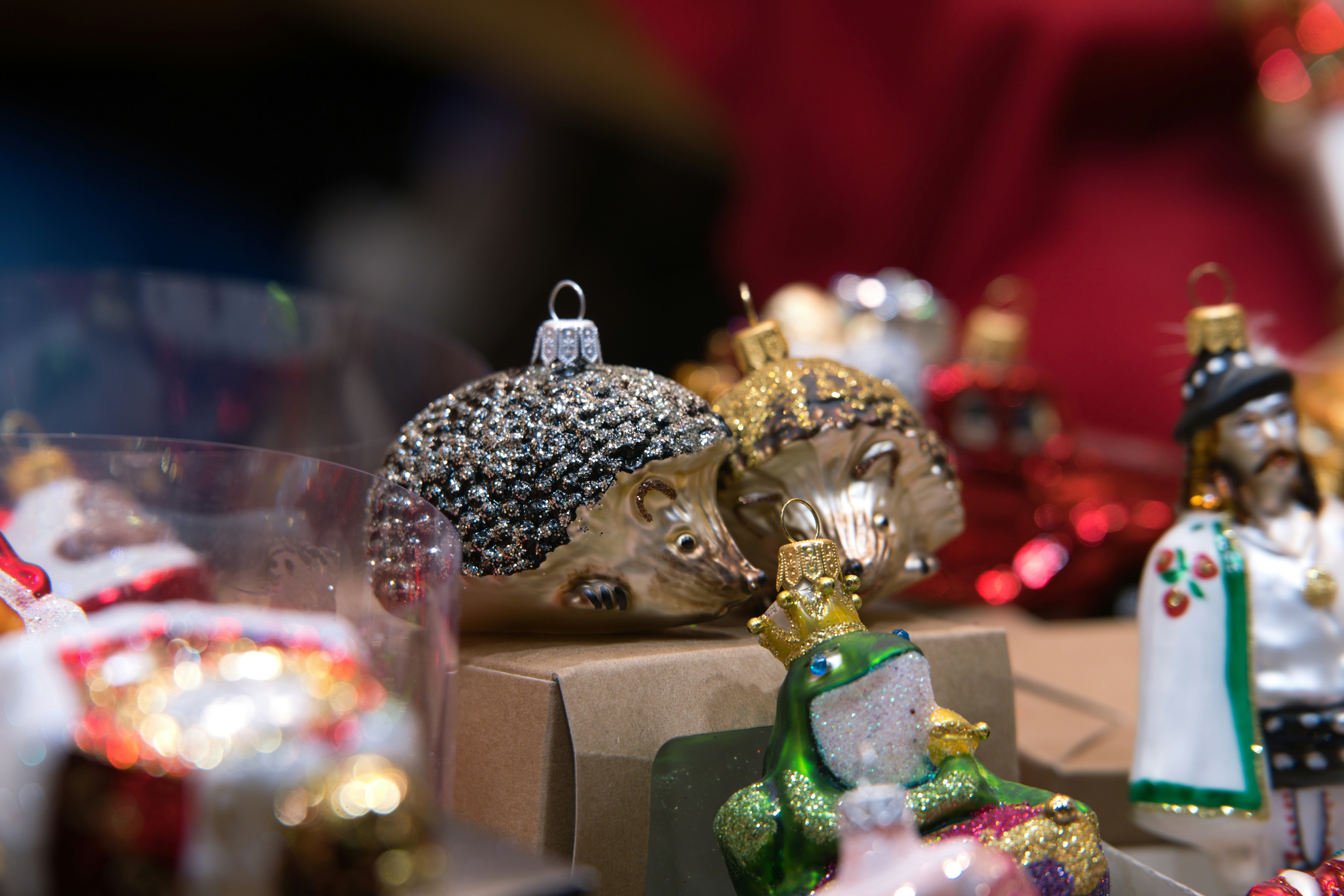 Two hedgehog christmas ornaments displayed together.