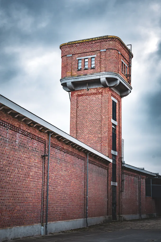 Old brick industrial building with a tall tower, the kind of railroad-era architecture found in the Juniata neighborhood of Altoona, PA