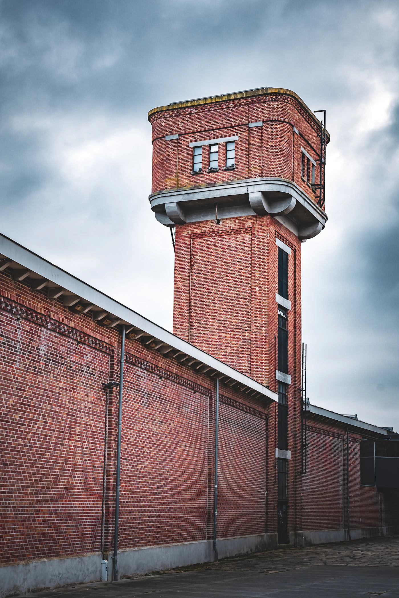 Historic red-brick industrial building and water tower
