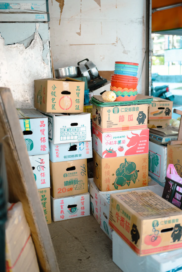 Stacks of cardboard boxes with produce labels