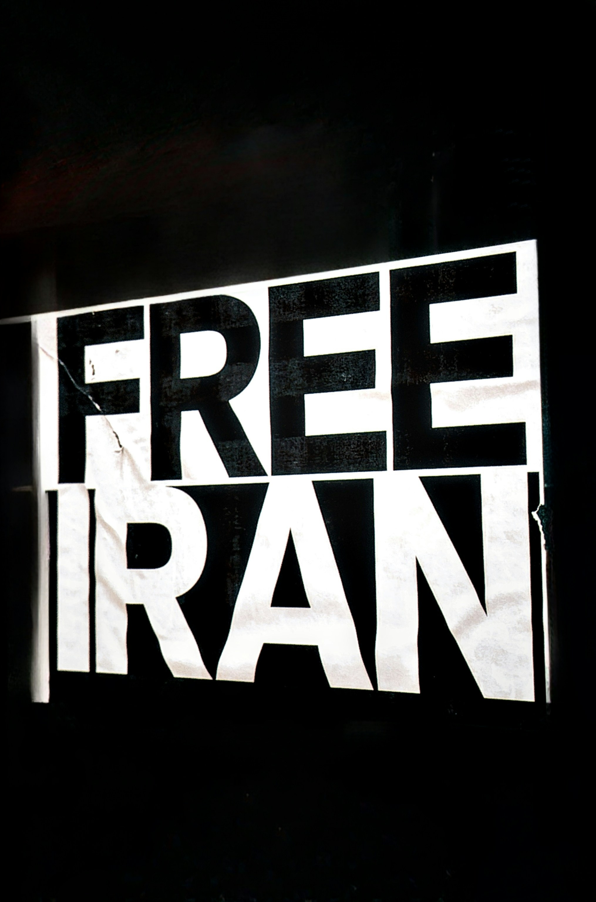 White text on black background says free iran