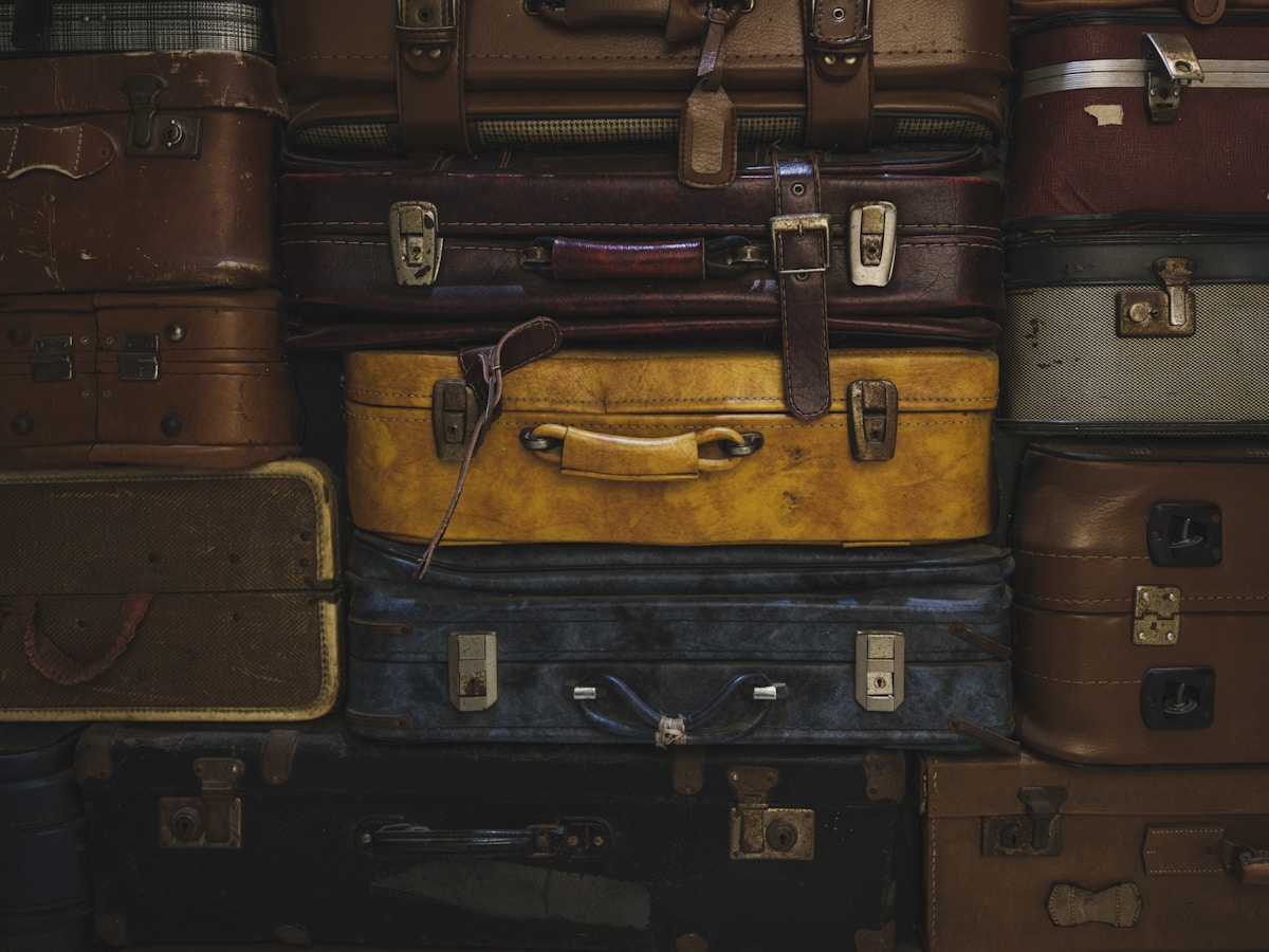 Stack of vintage suitcases in various colors
