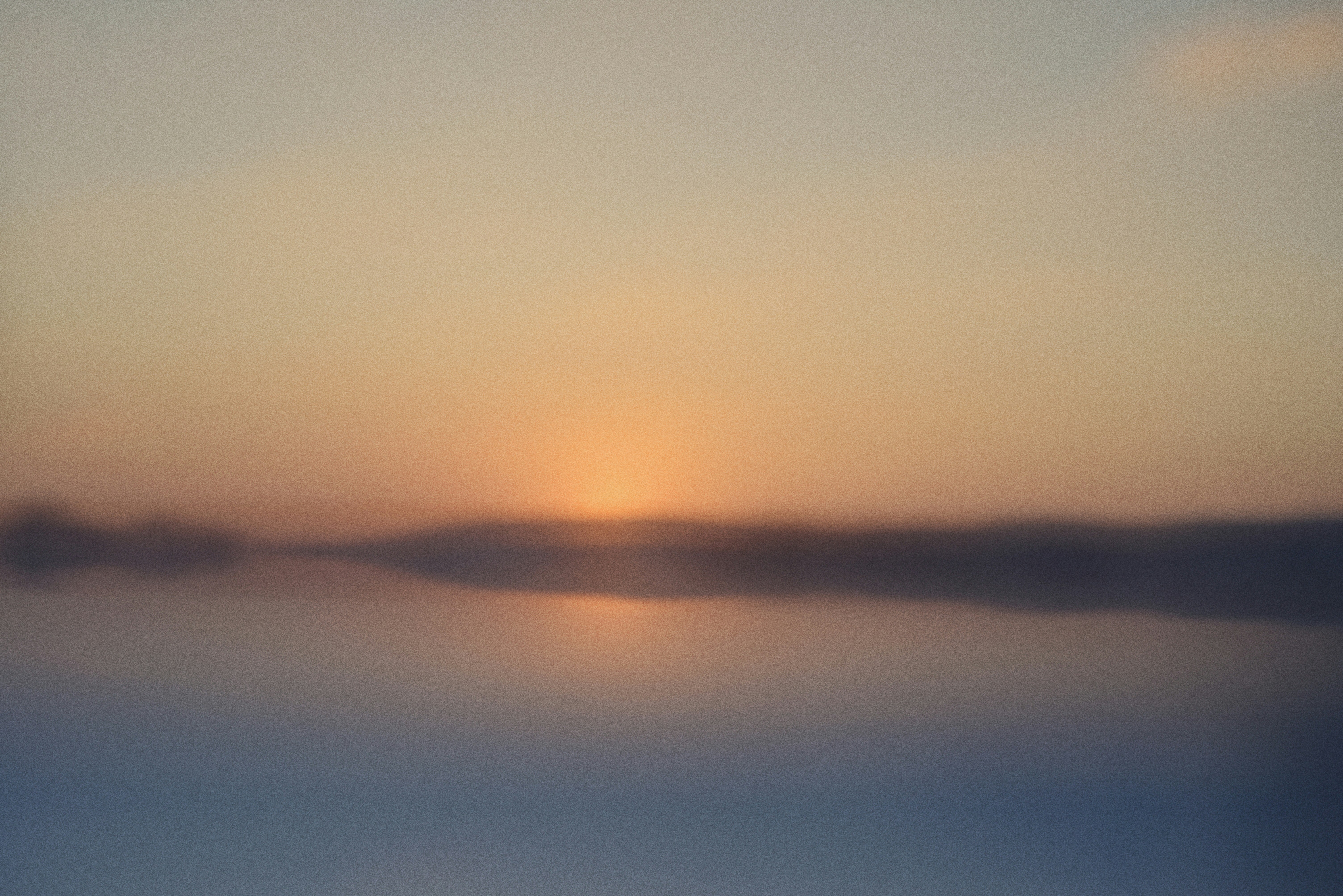 Sunset over a calm body of water