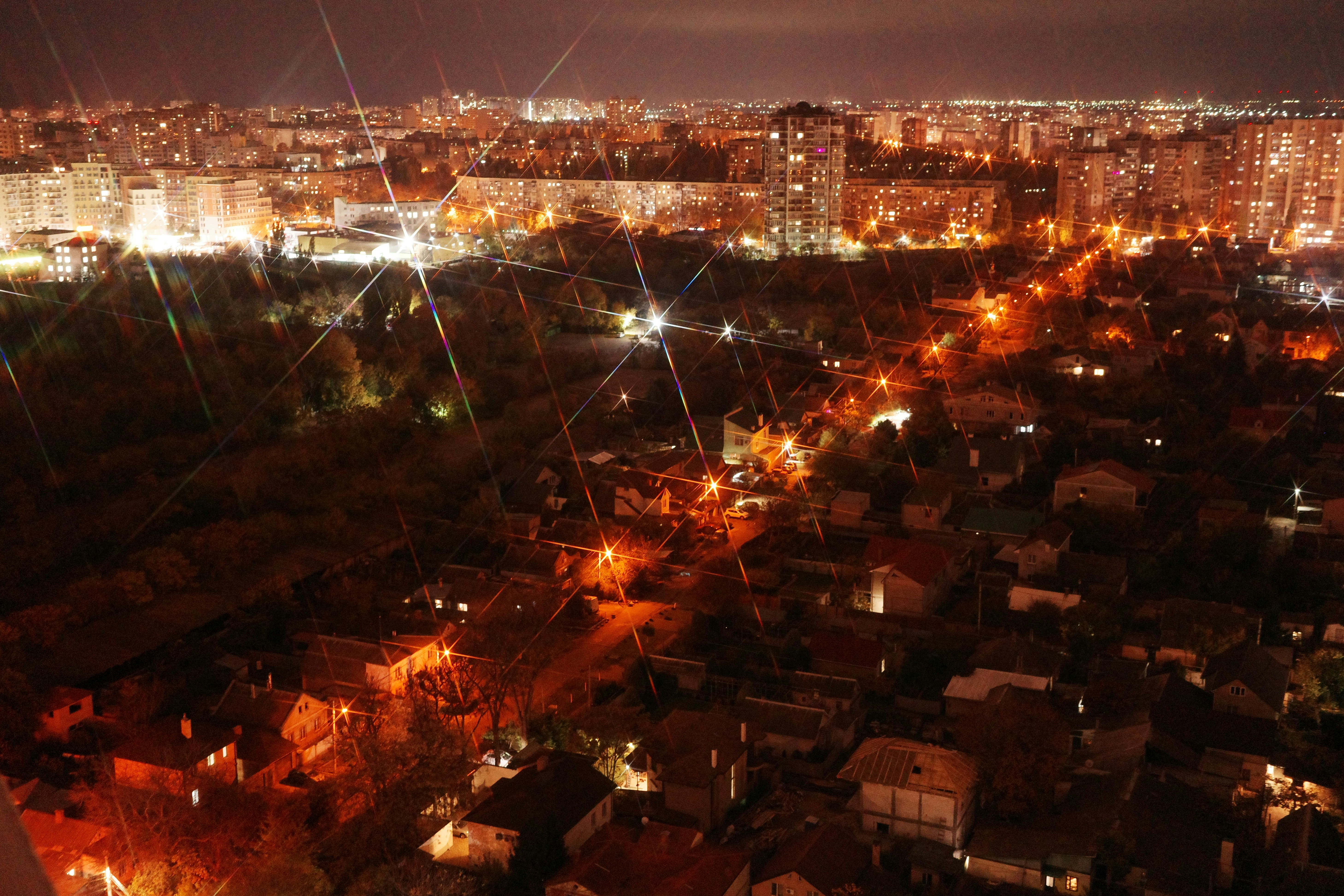 City lights illuminate the urban landscape at night.
