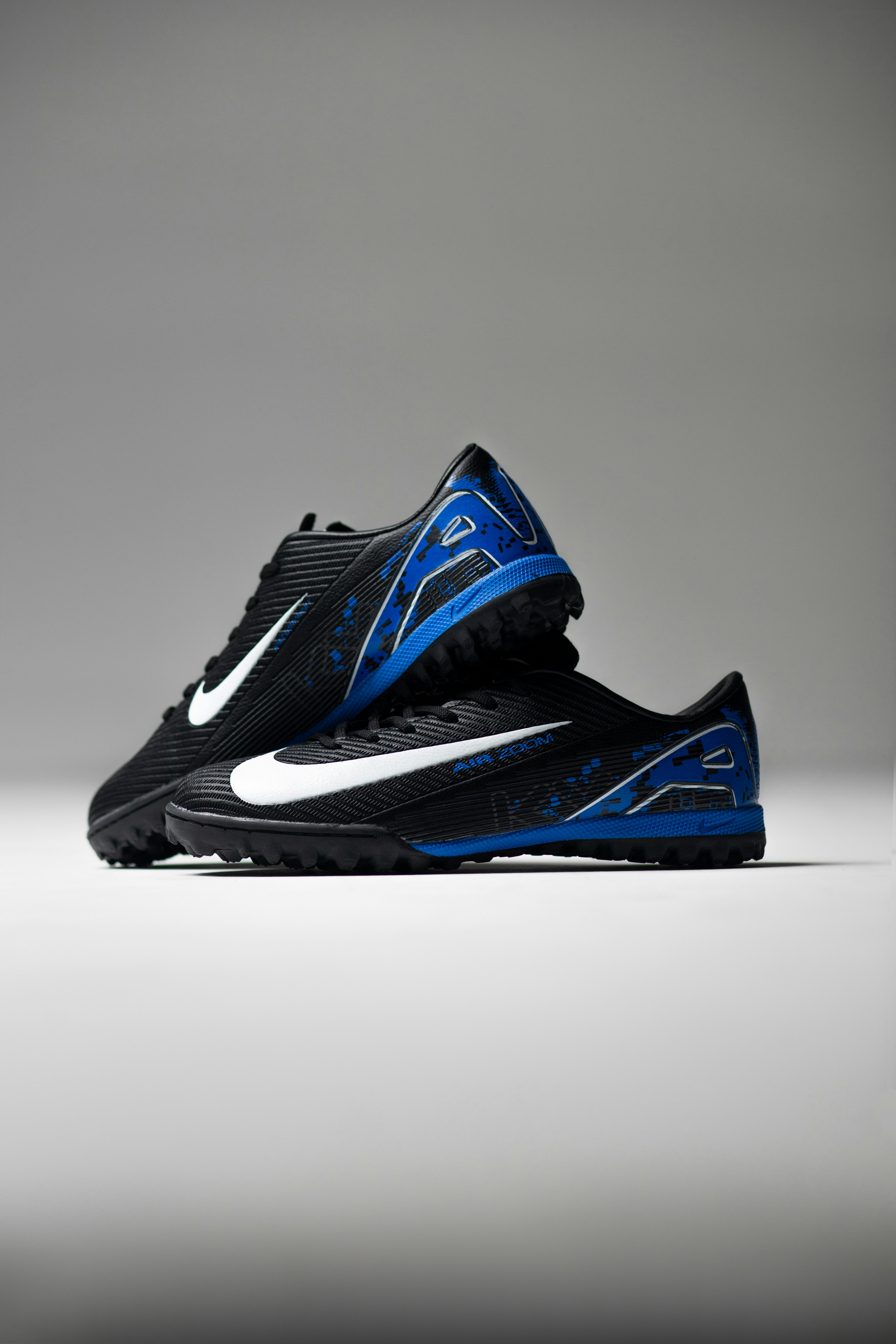 Pair of black and blue soccer cleats