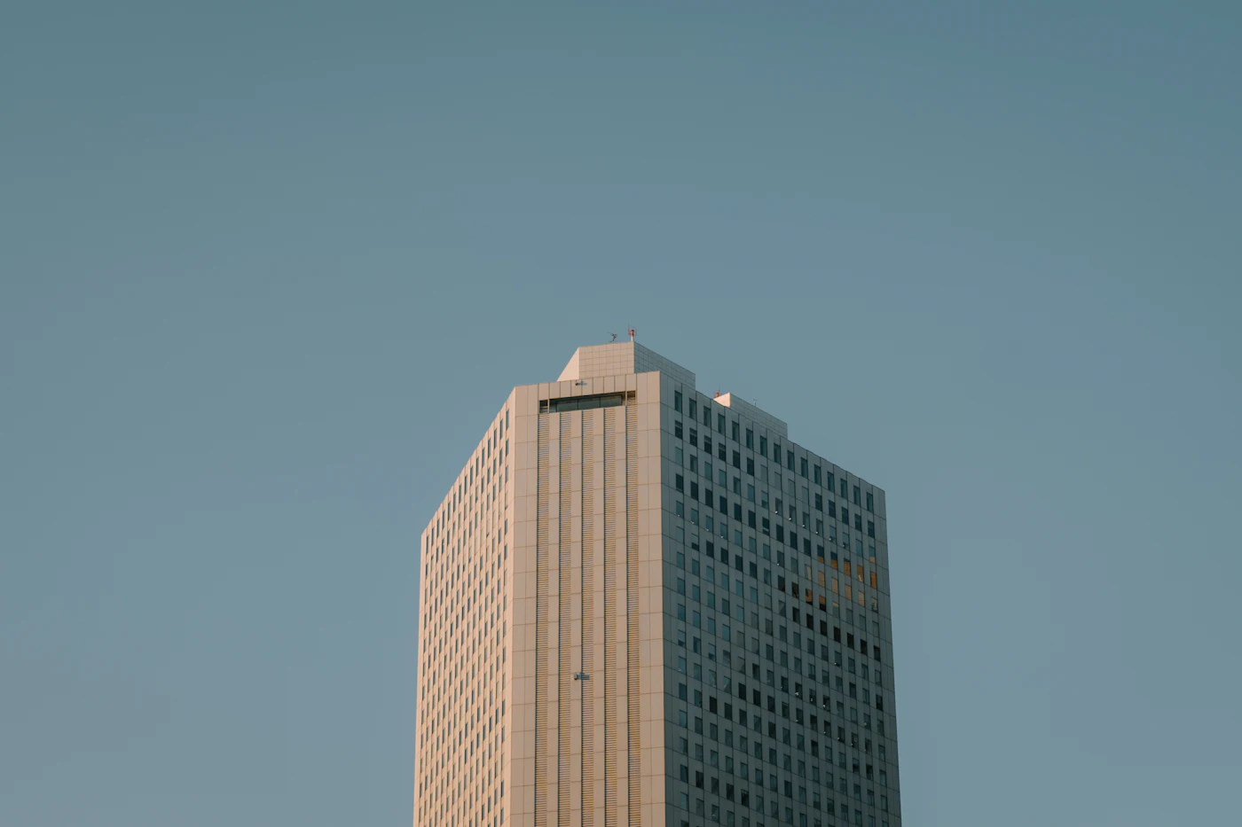 Modern office building exterior against a clear sky