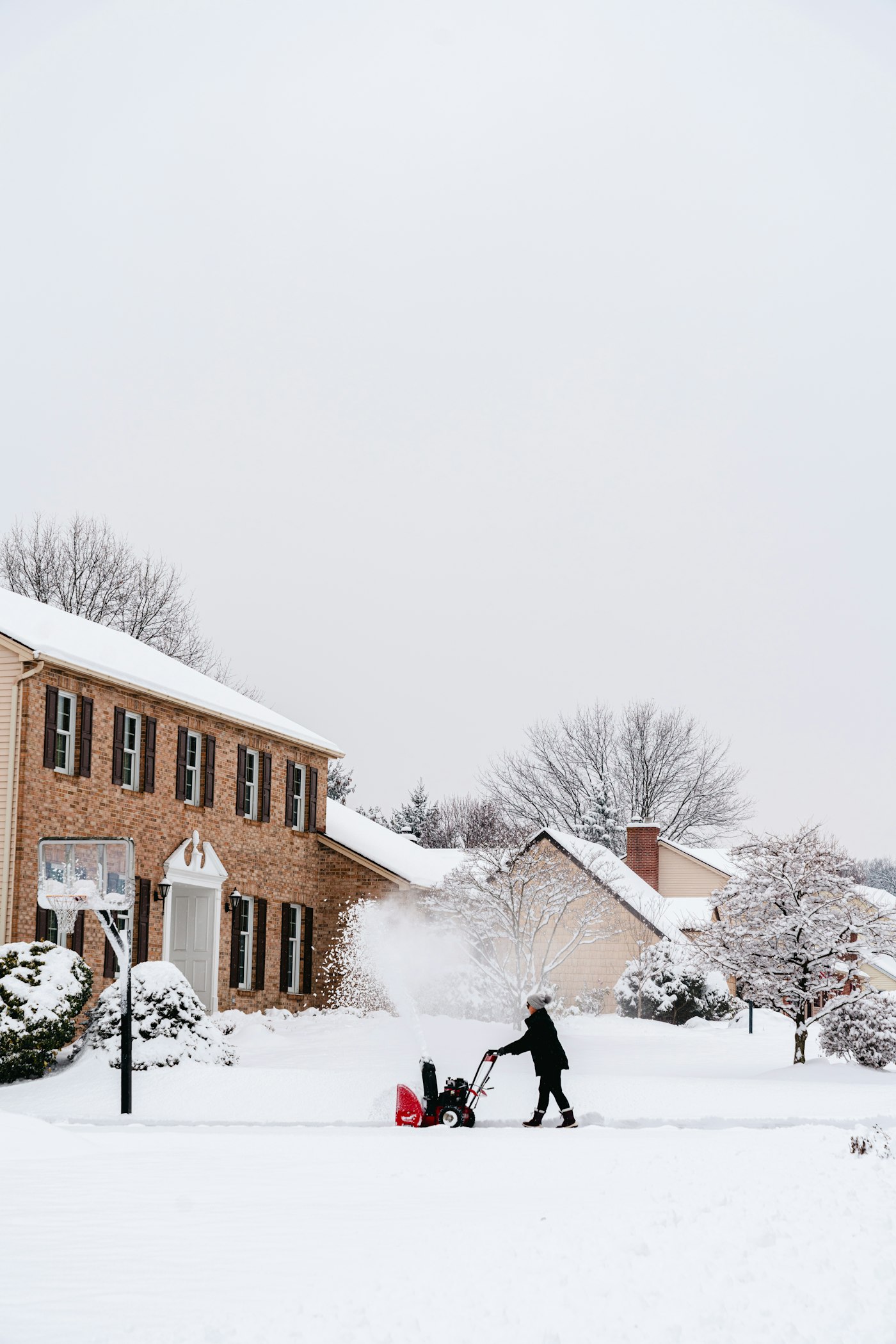 A snowy residential driveway just cleared after a Buffalo storm.