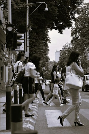 People crossing a city street in a marked crosswalk, where Nevada law requires drivers to yield