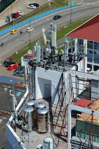 Rooftop antennas and communication equipment on a building.