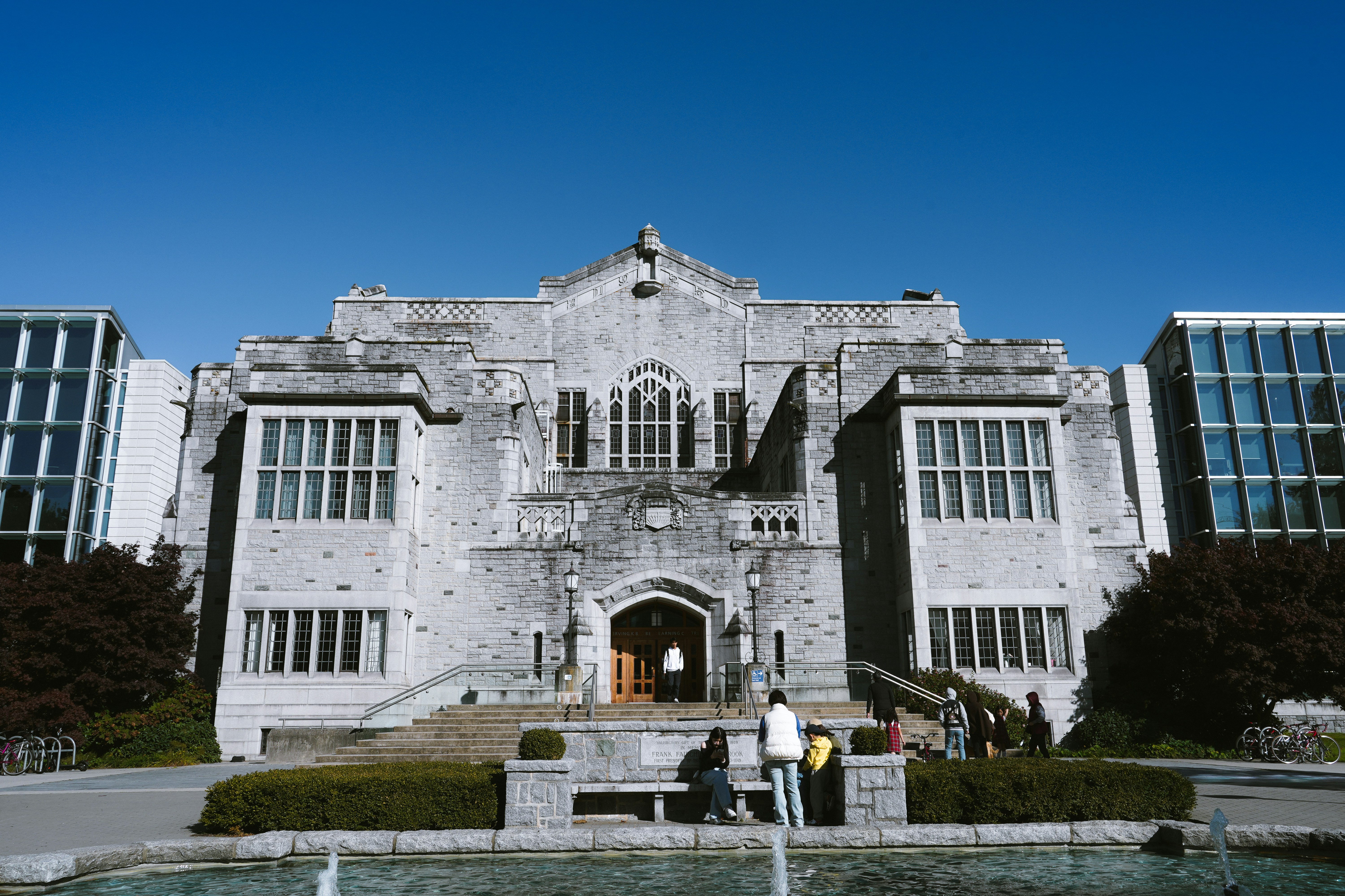 Grand stone building with arched entrance and windows