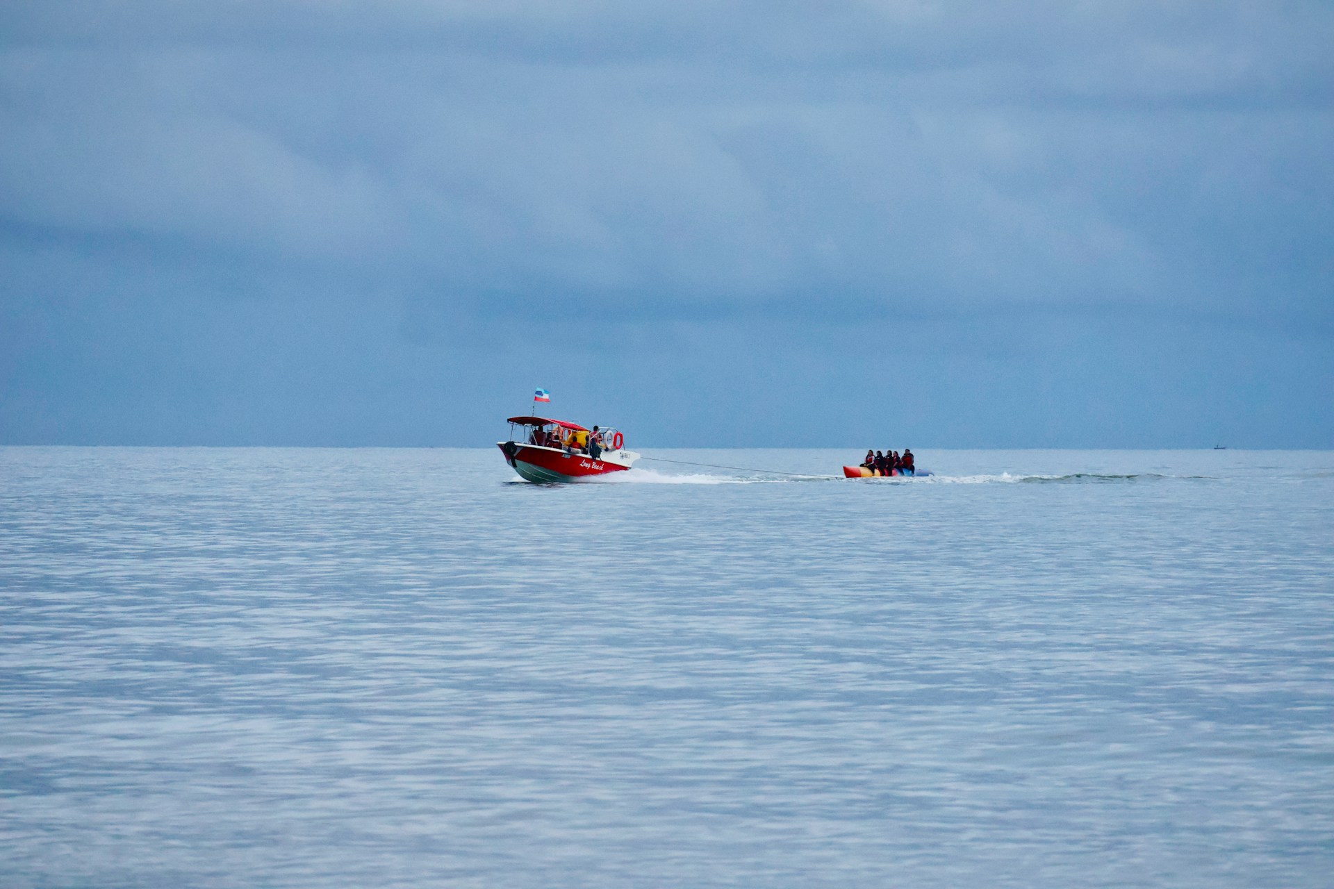 Two boats sailing on a calm blue ocean
