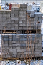 Stacks of grey paving stones on a pallet