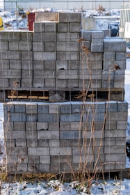 Stacks of grey paving stones on a pallet