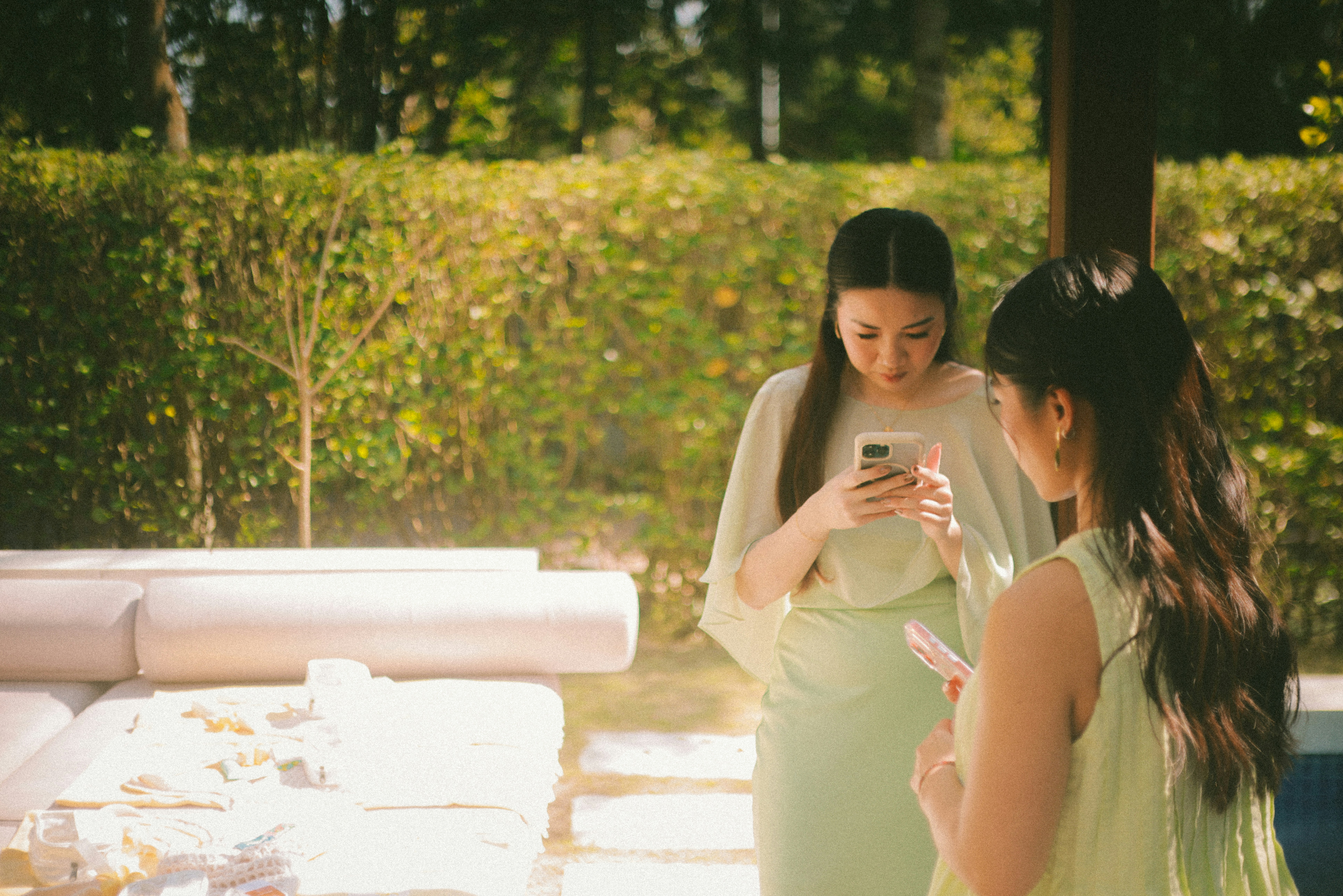 People checking their phones outdoors, representing verifying eSIM compatibility in phone settings