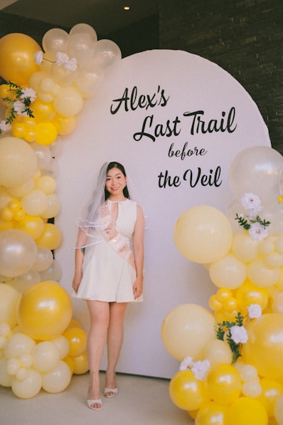 Bride-to-be poses at a "last trail before the veil" party.