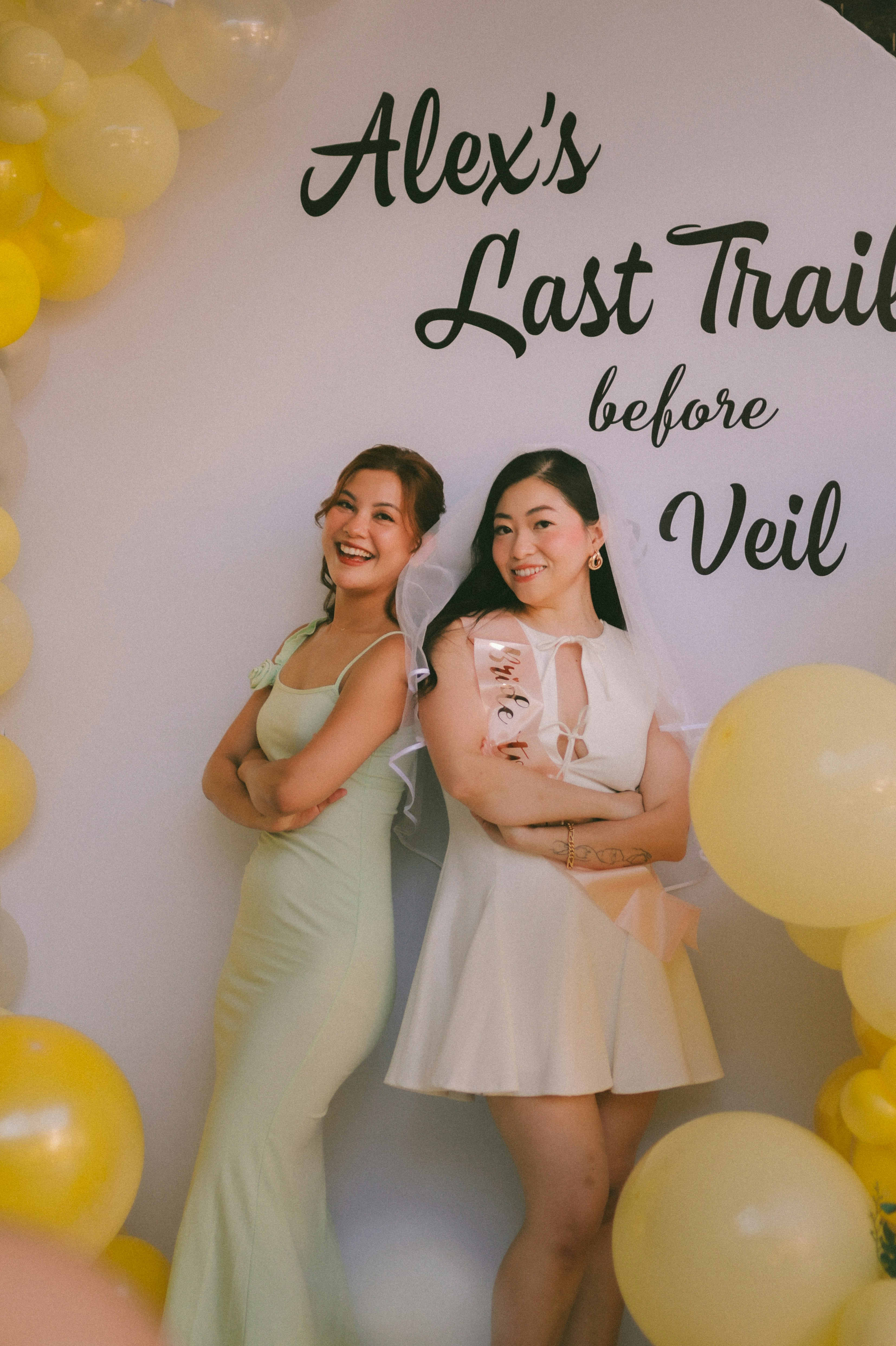 Two women at a bridal shower with balloons