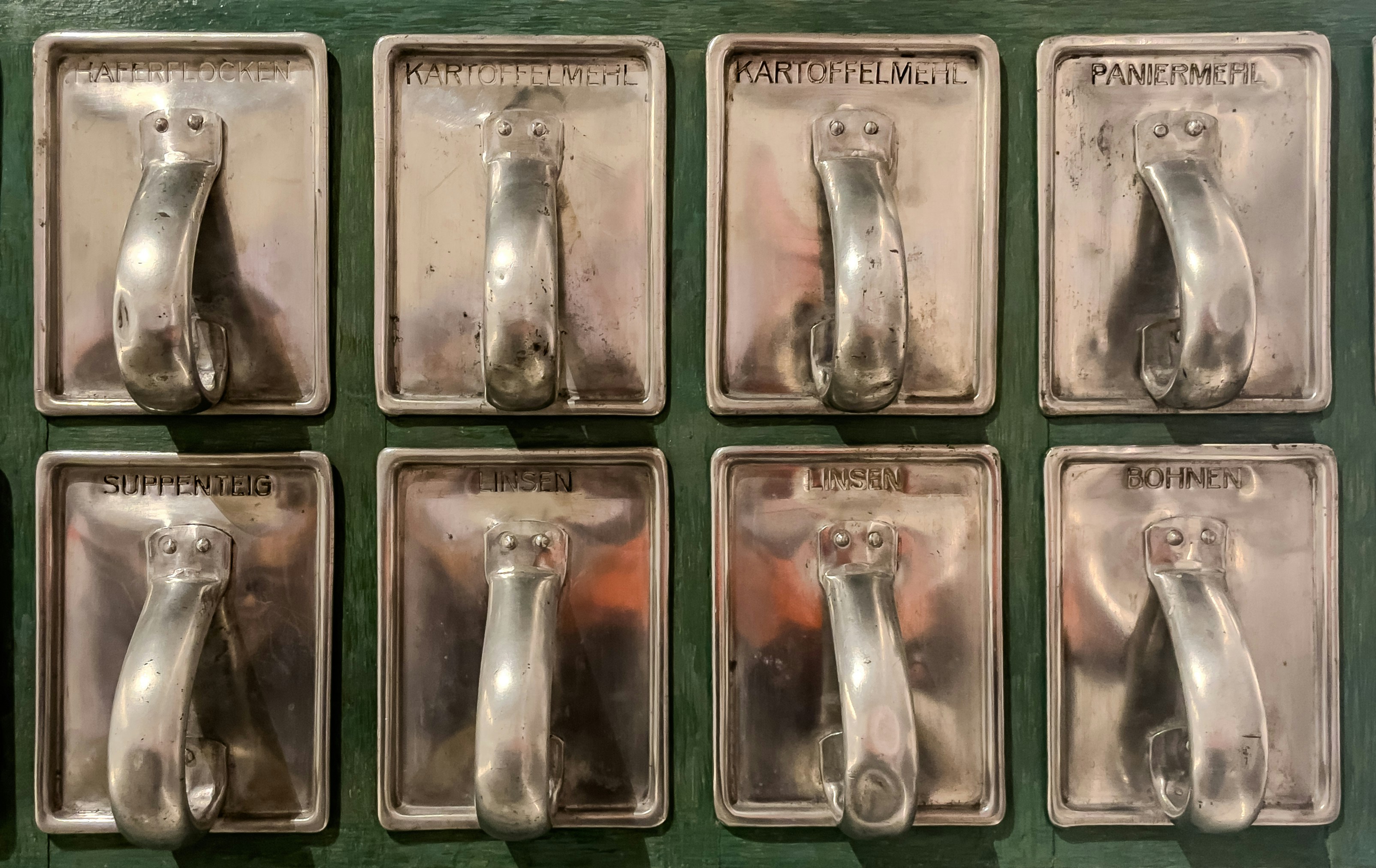 Eight vintage light switches with labels