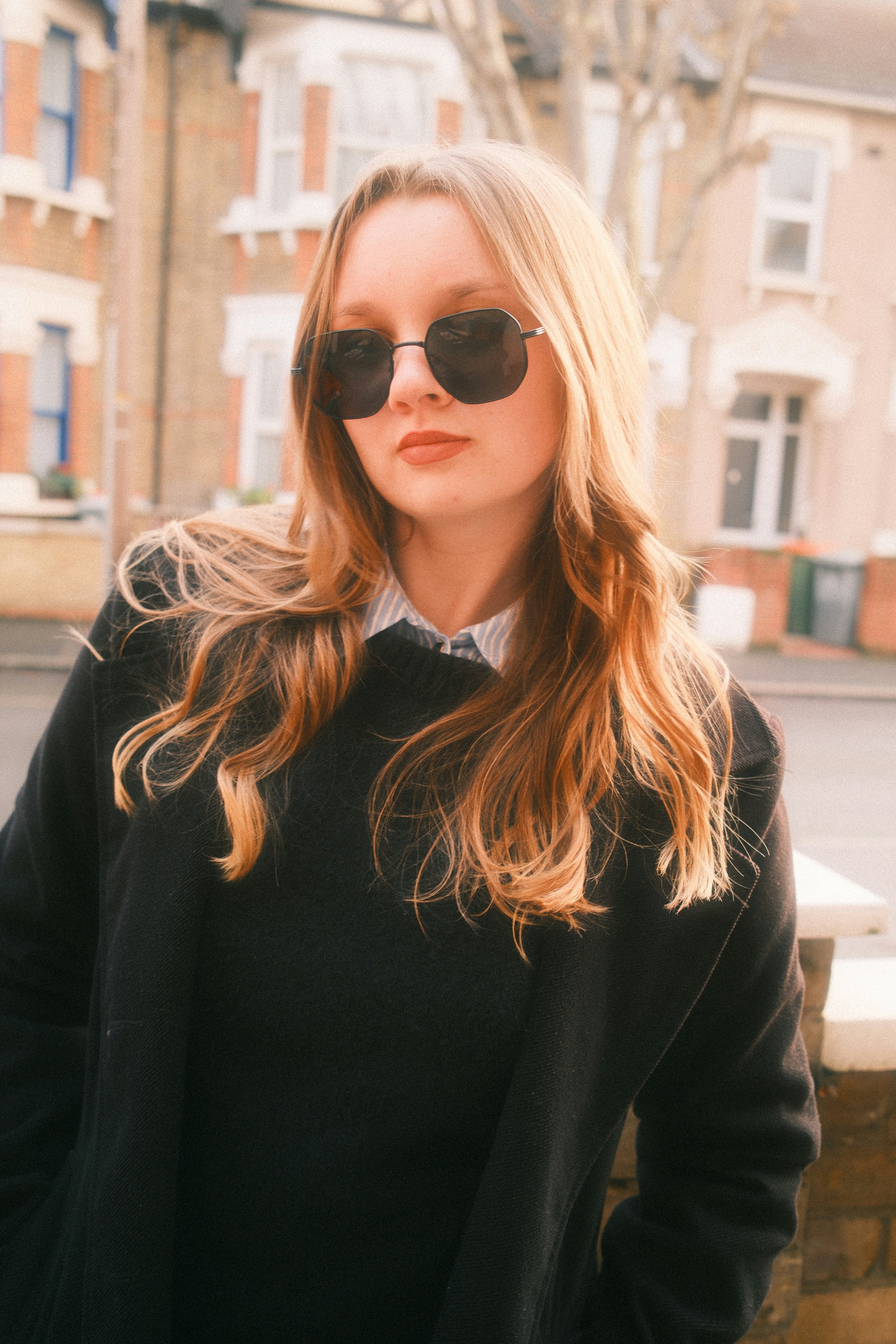 Young woman with sunglasses and blonde hair