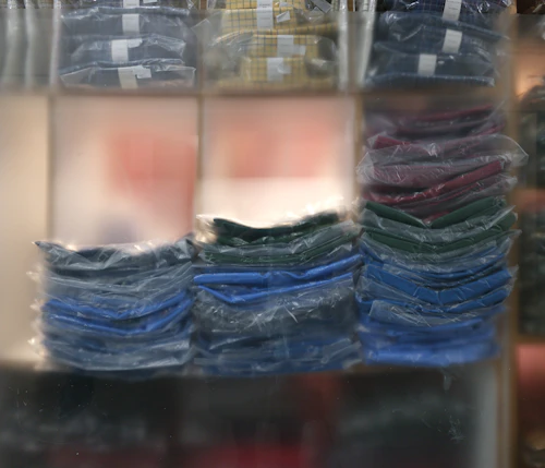Neatly stacked colorful folded fabric merchandise