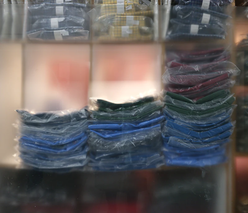 Stacks of folded fabric sets in coordinated colours