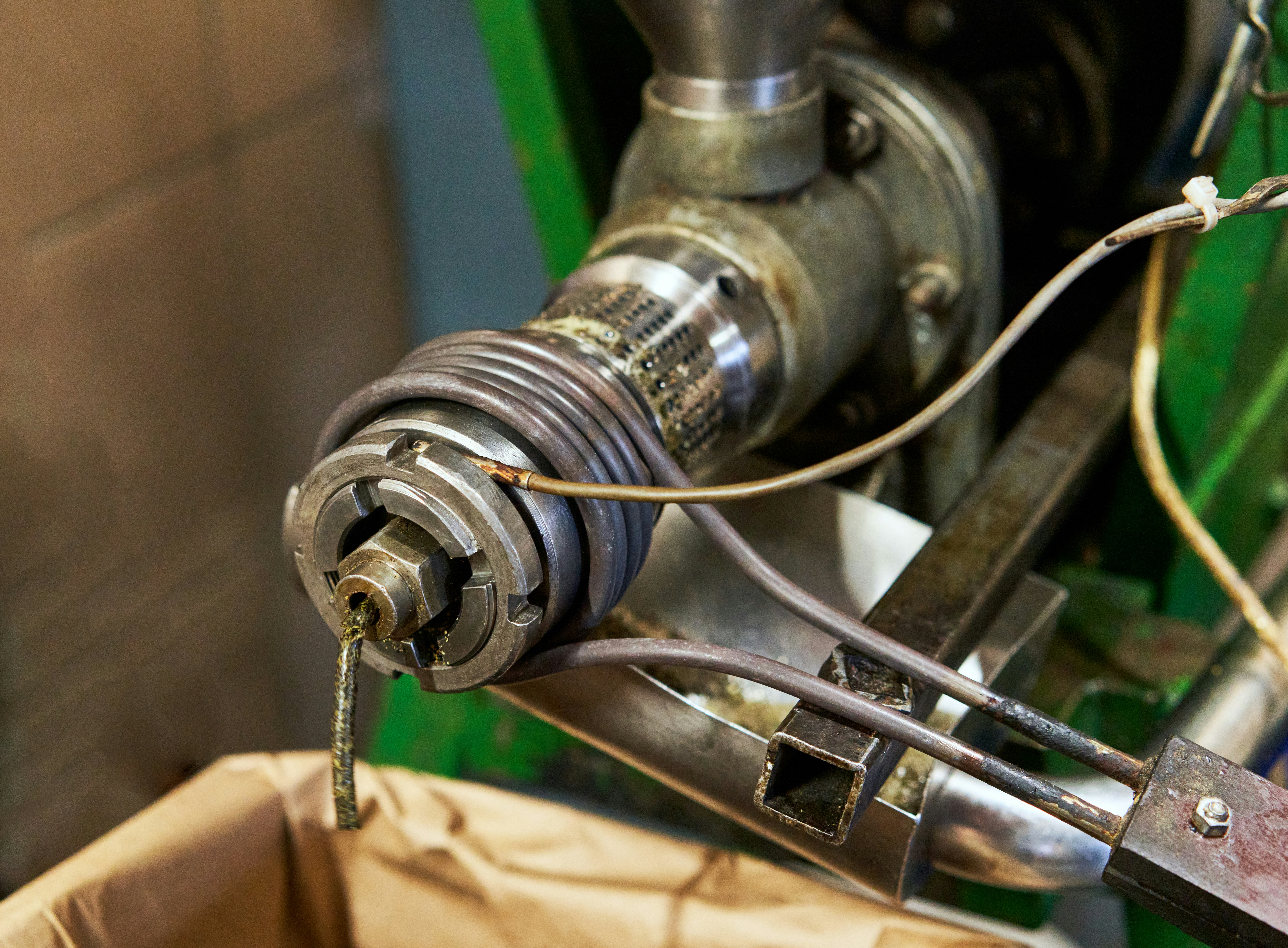 Industrial machine extruding material into a bag