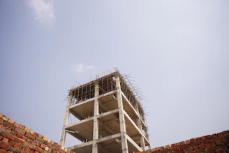 Concrete building under construction against a clear sky