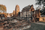 Ancient ruins of a temple complex at sunset